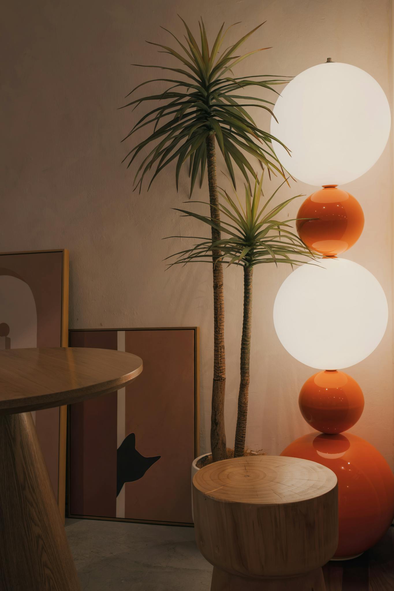 Warm modern interior featuring artistic decor, abstract art, and unique lighting.