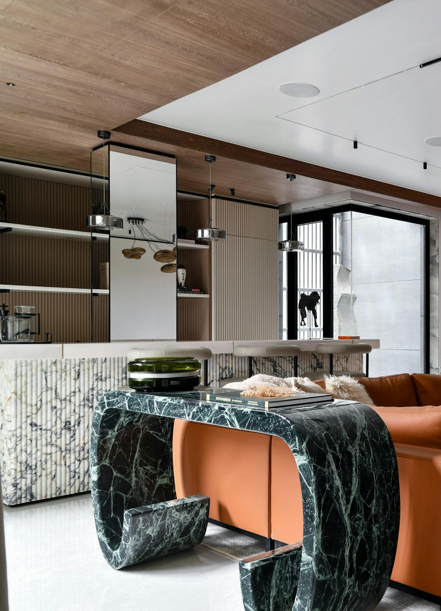 Sophisticated living room with marble elements and modern furniture design.
