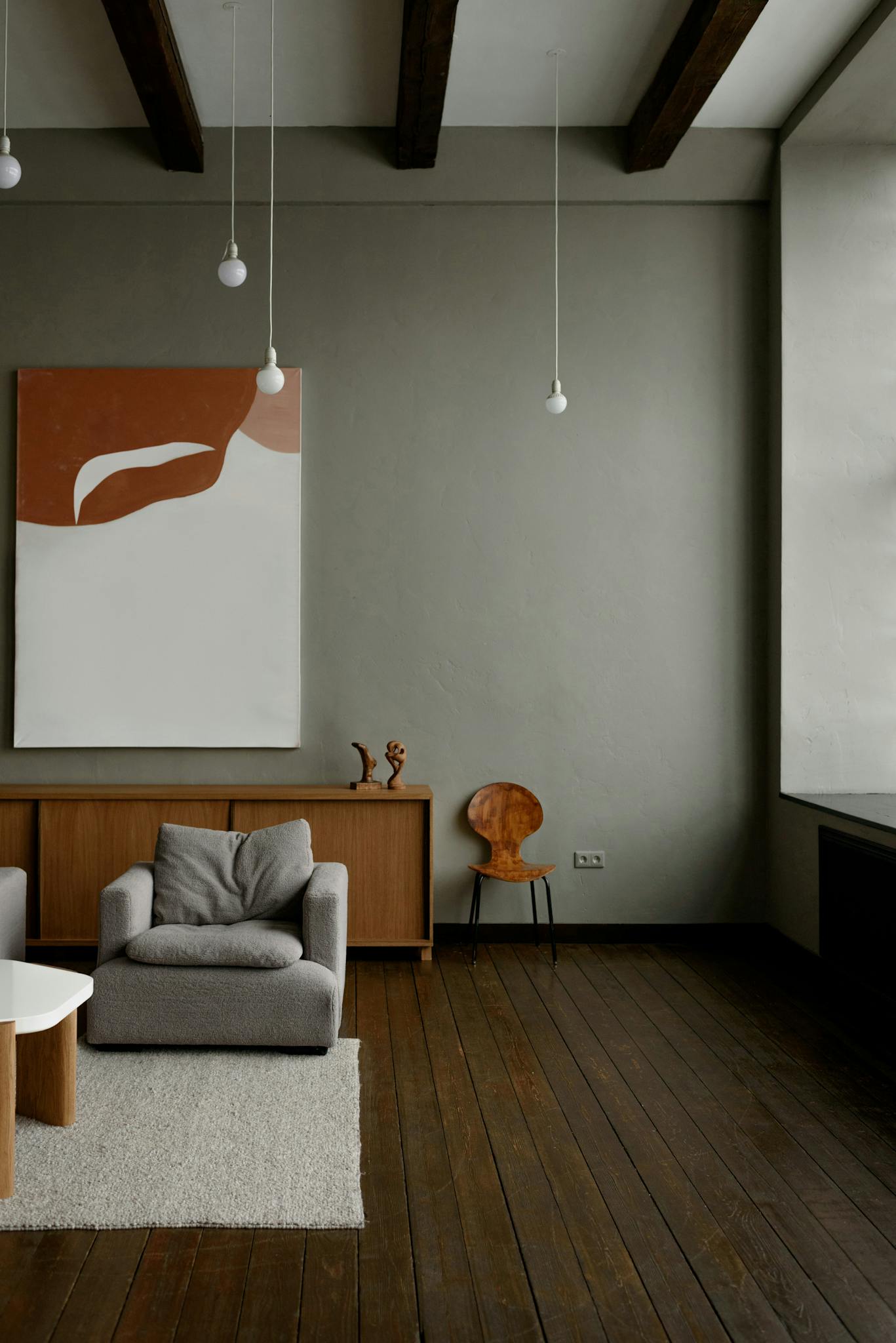 Stylish minimalist living room with modern furniture and neutral tones.